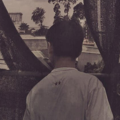 Hung looking at the horizon in a gloomy afternoon